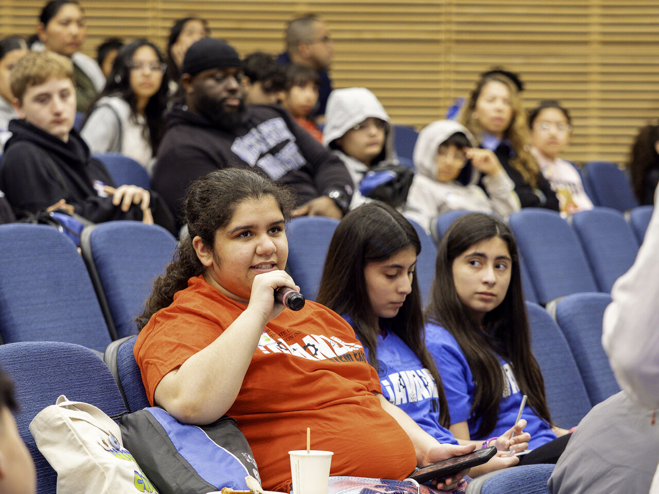 Student asking a question during the workshop audience